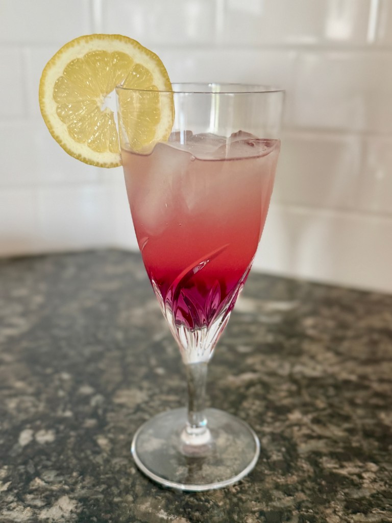 A glass of color-changing lemonade